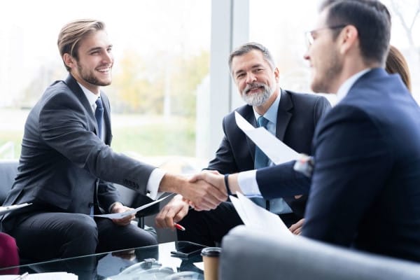 attorney shaking hands with clients1